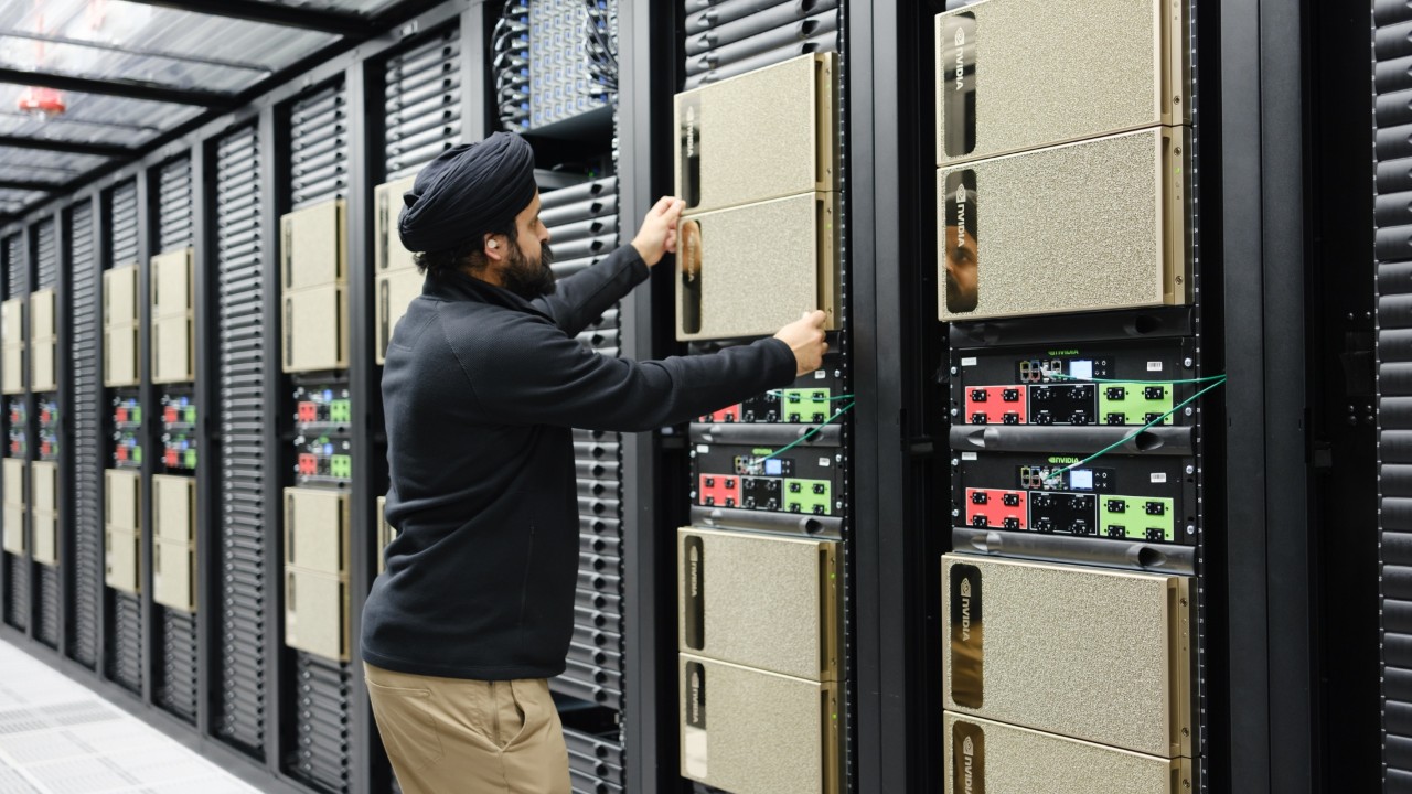 An image of a person installing hardware in a data center.